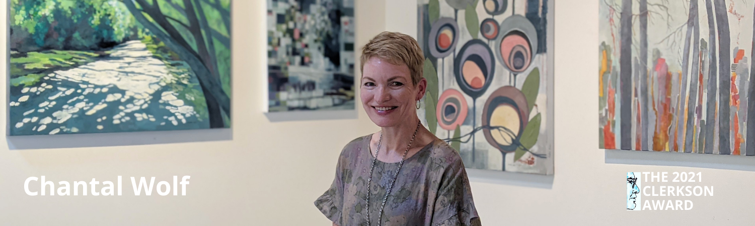 Chantal Wolf, artist, stands in front of her paintings in the BMFA exhibit hall.